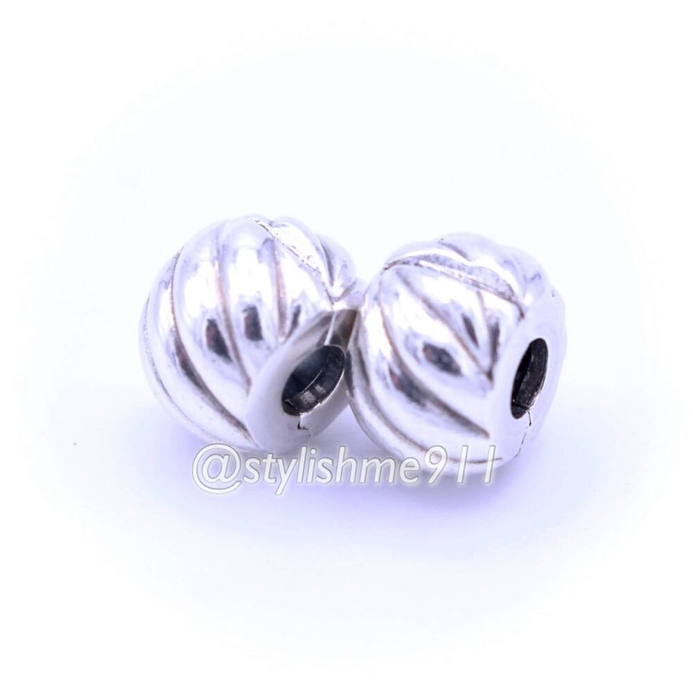 Two Authentic PANDORA Retired Feathered Clips - 791752